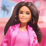 Gloria Doll Wearing Pink Power Pantsuit – Barbie The Movie