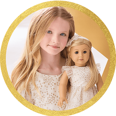 Girl playing with a Truly Me doll