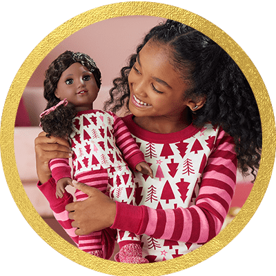 Girl playing with a Truly Me doll