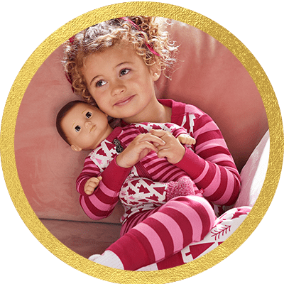 Little girl holding a Bitty Baby doll