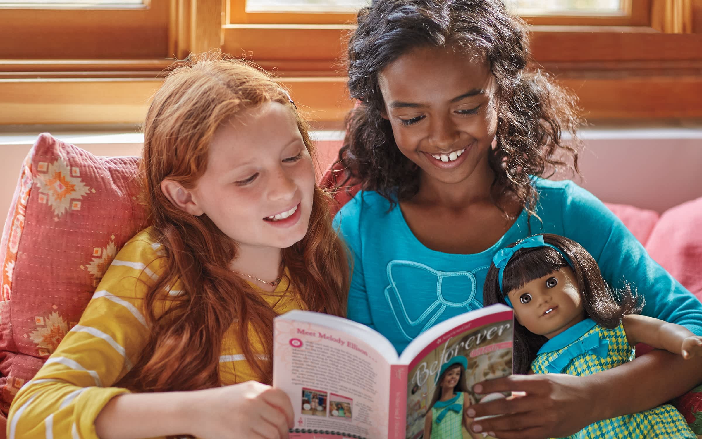 Image of girls reading with Melody Ellison doll