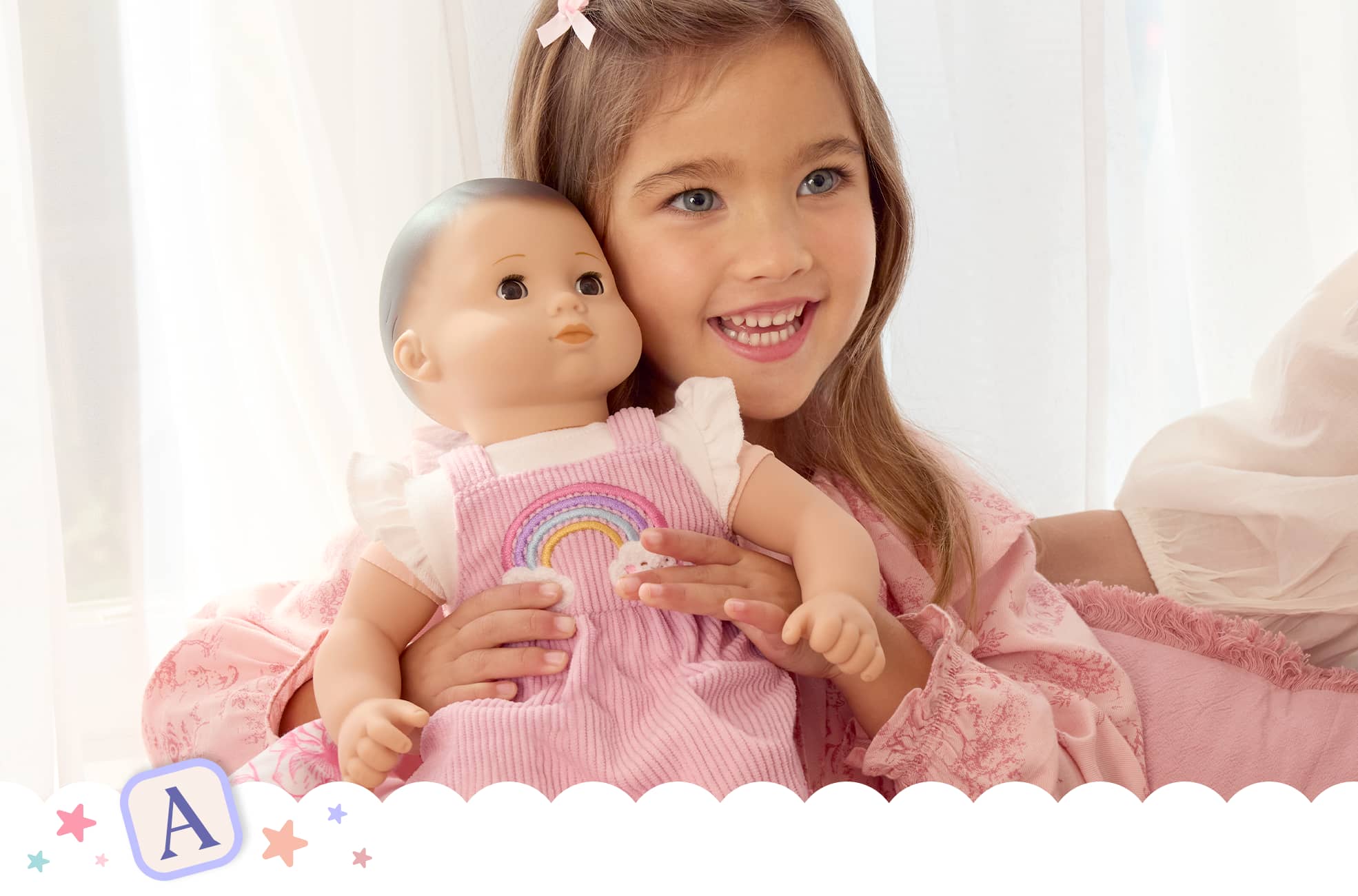 Young girl holding up her Bitty Baby