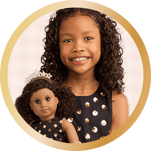 AG x J.Crew collab with girl holding doll in matching black polka dot dress
