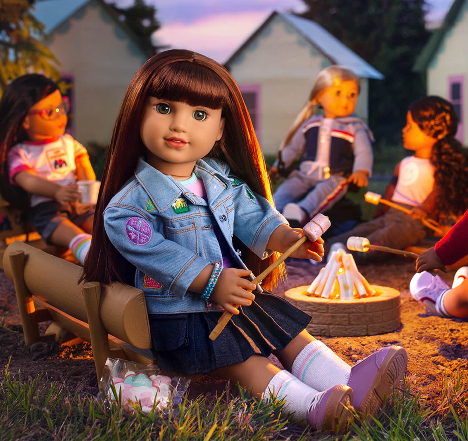 Girl of the Year 2027 Daisy Davenport with s'mores next to campfire