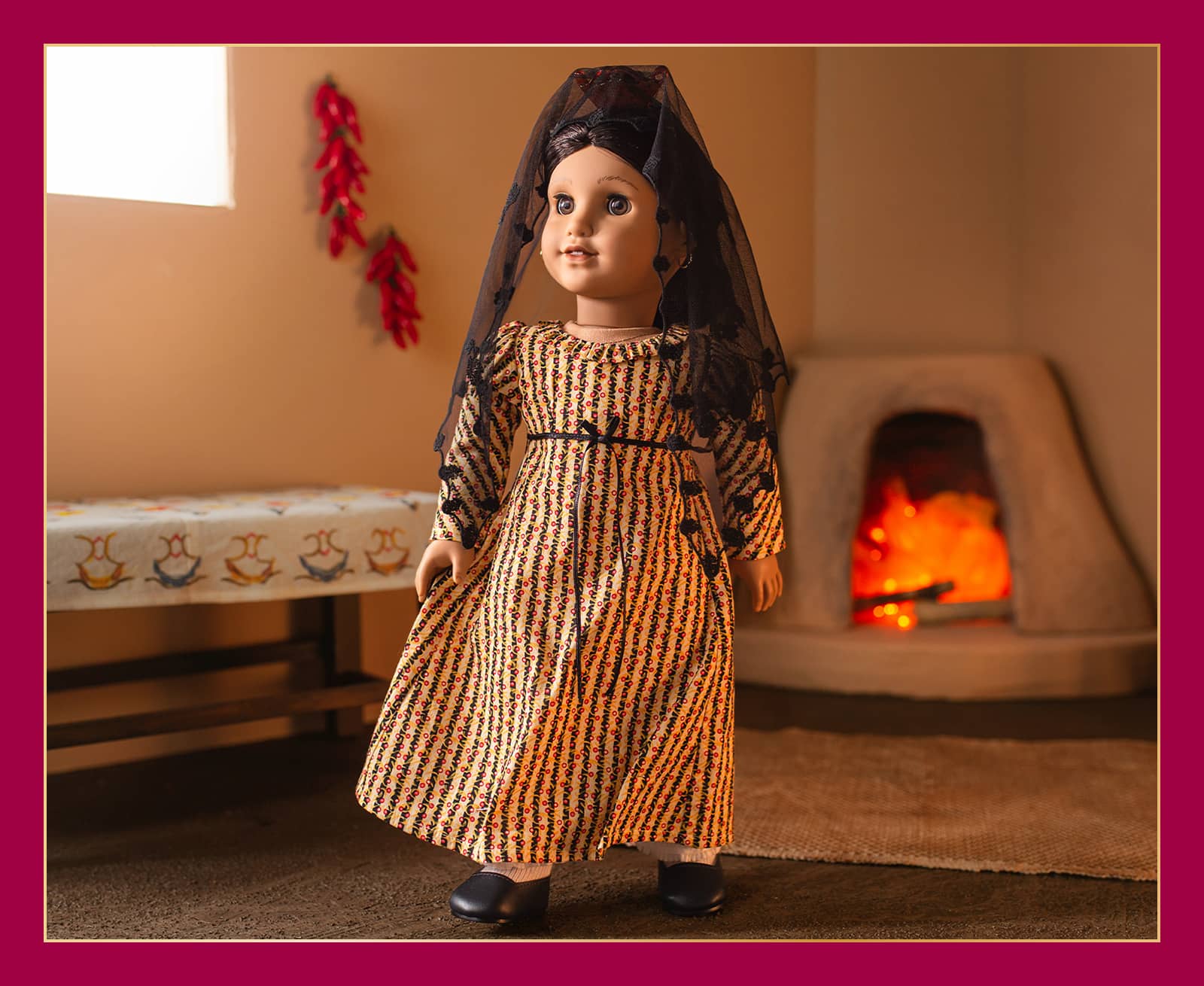 Josefina standing in her Christmas dress and mantilla in a kitchen