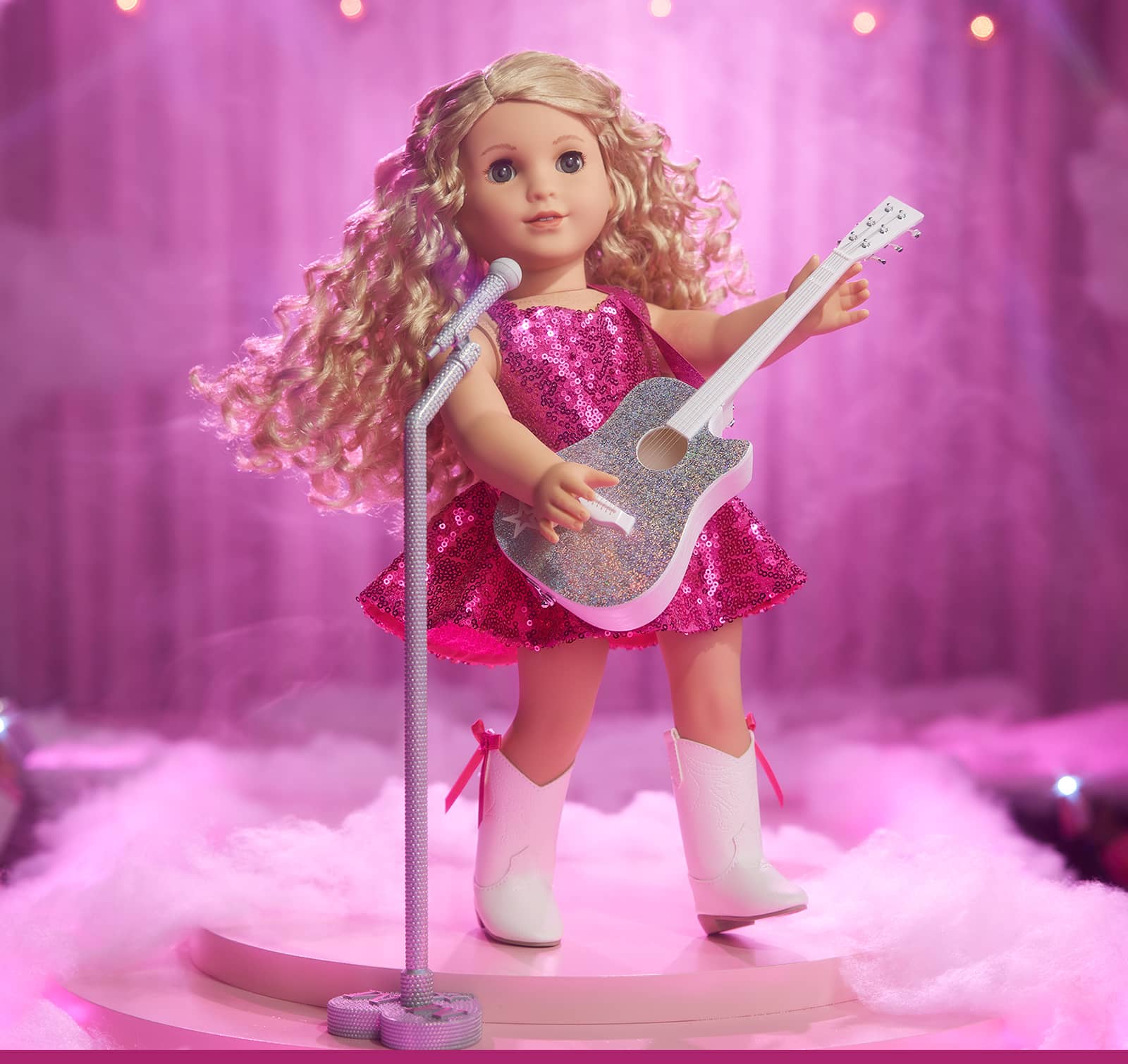 Doll in stage outfit with guitar
