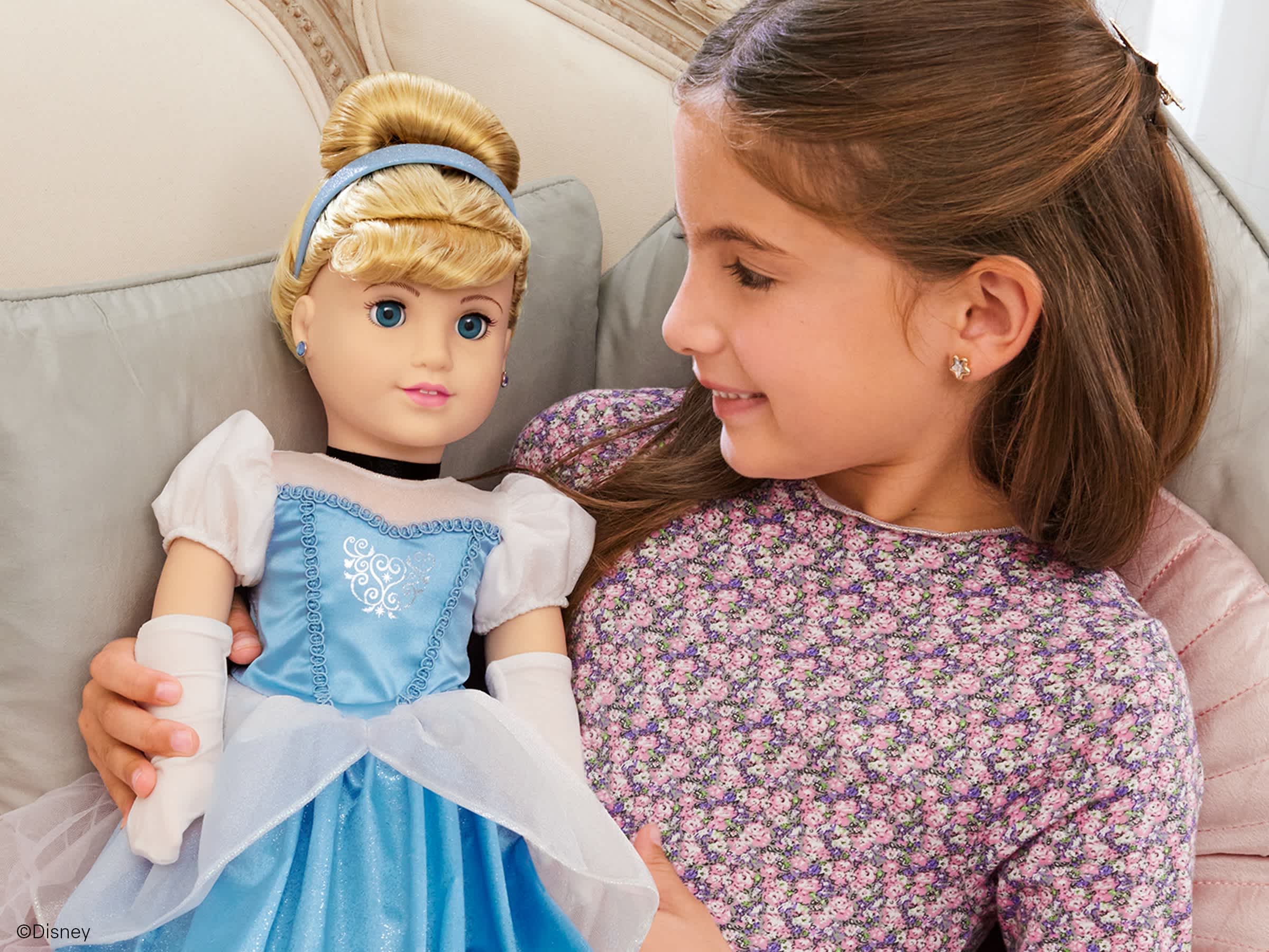 Girl playing with Disney Princess Doll, Cinderella