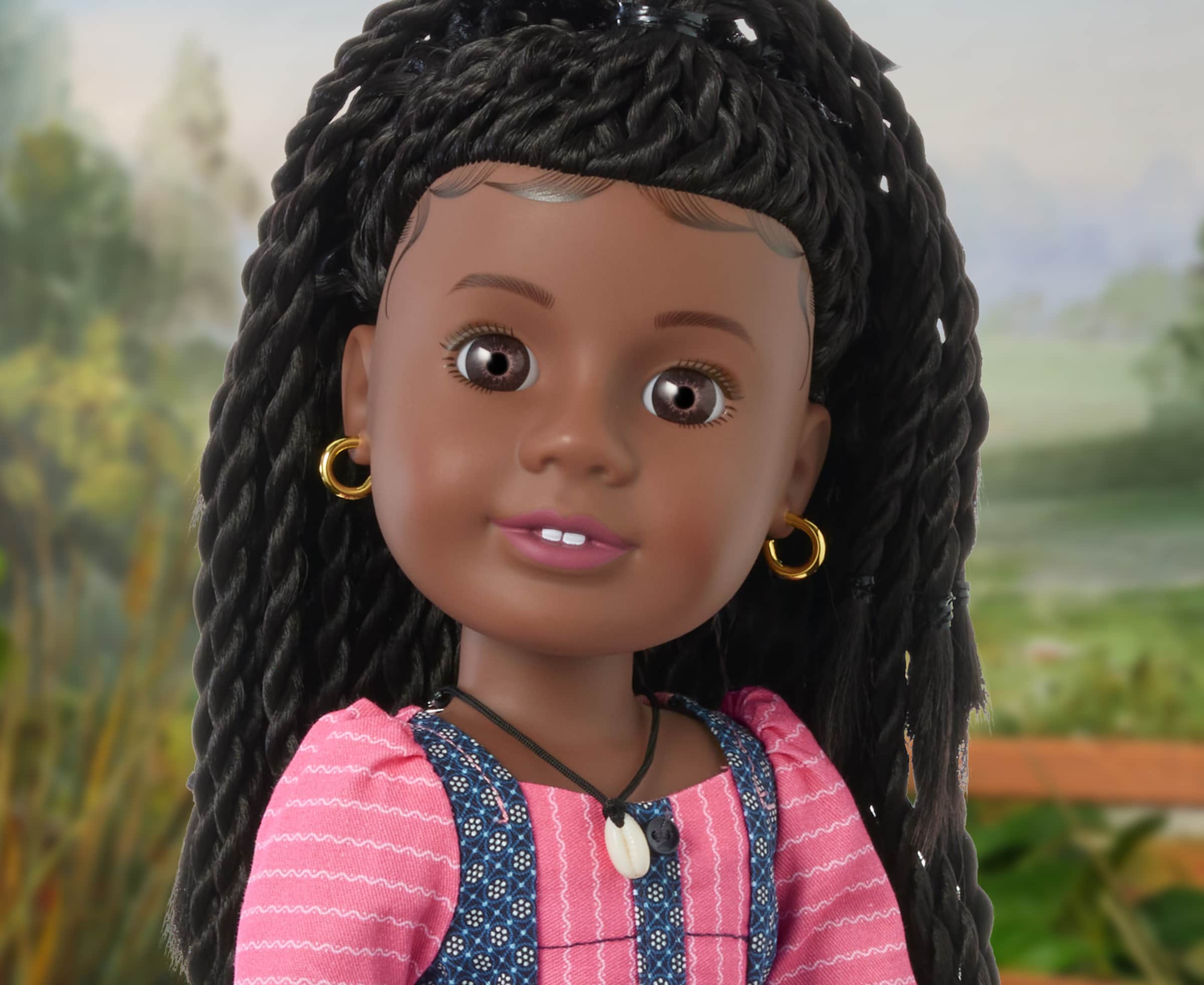 Close up image of Modern Era American Girl doll, Addy, smiling