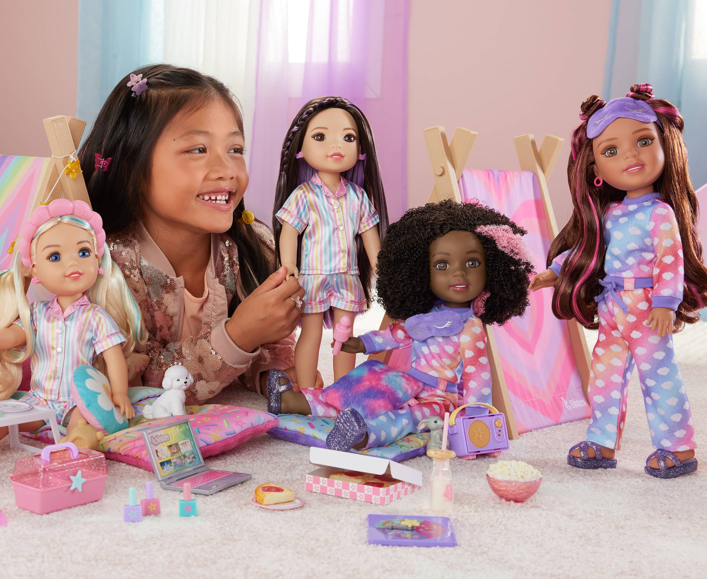 Girl playing with AG Sisters dolls