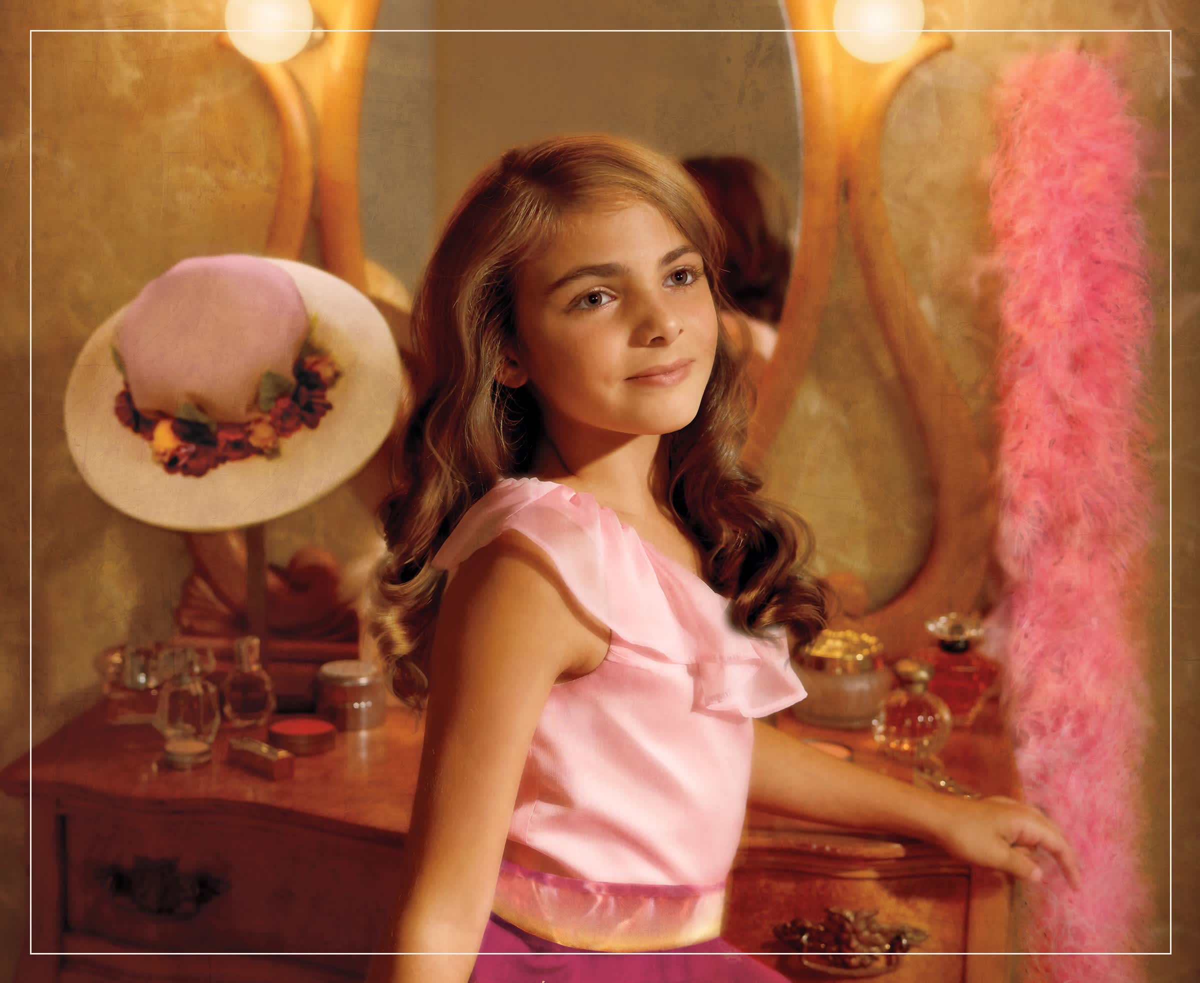 Image of Rebecca Rubin wearing a pink outfit and standing in front of a mirror