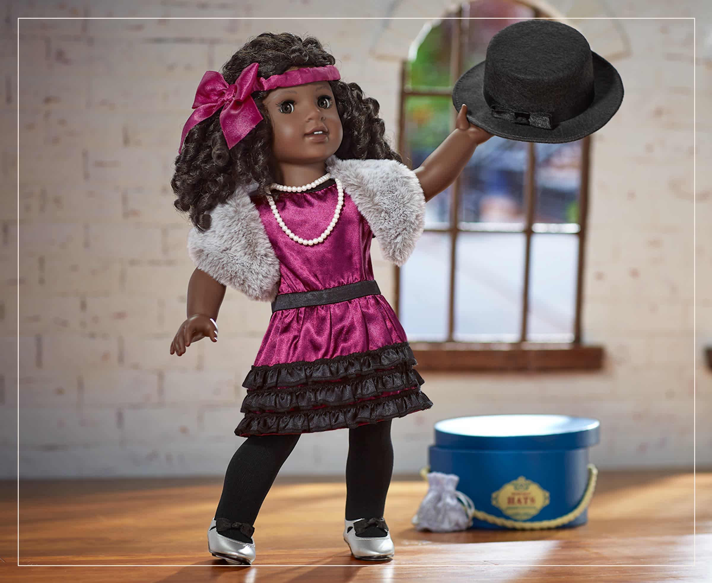 Claudie Wells doll wearing a purple outfit and dancing