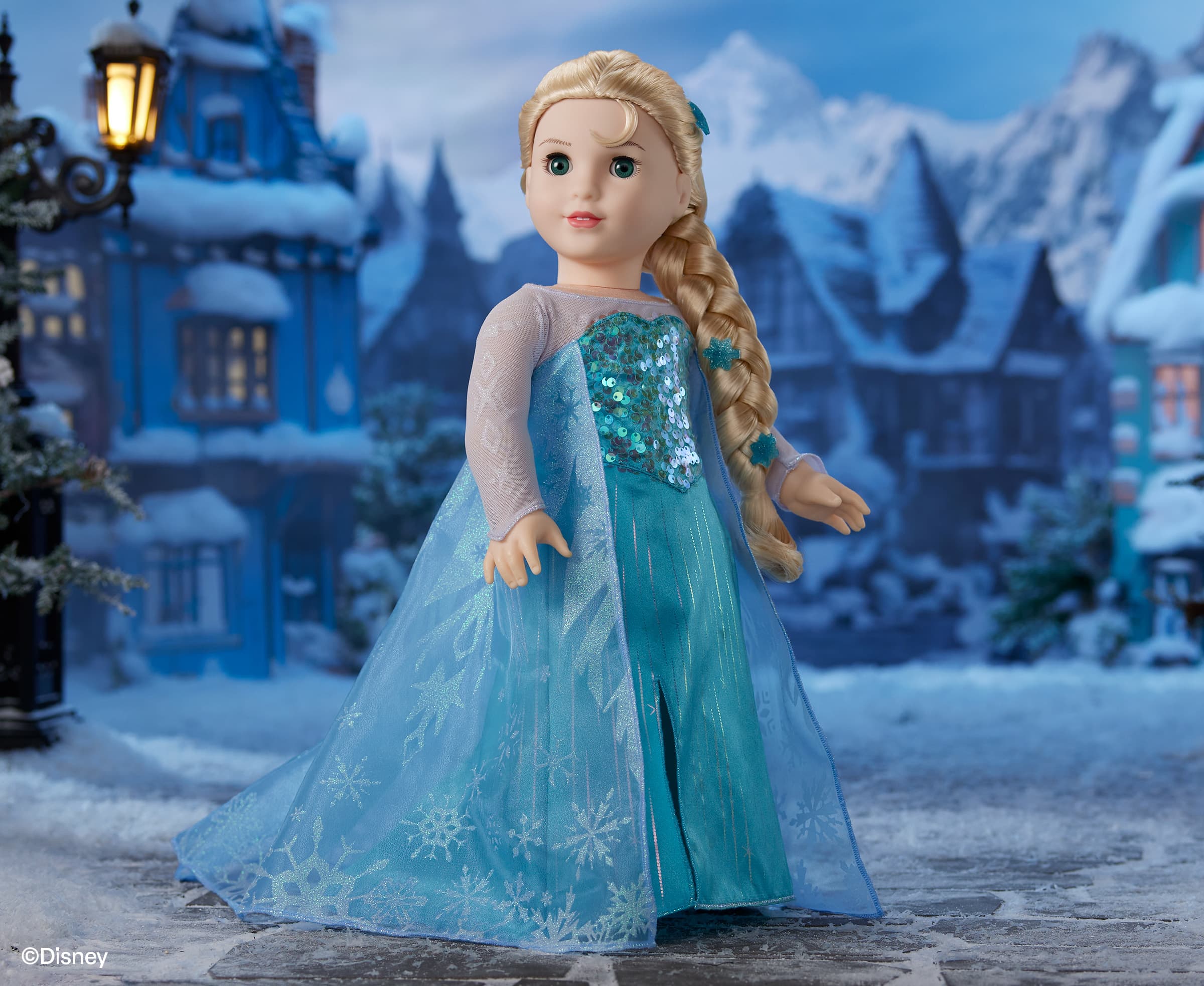Elsa standing in her blue dress