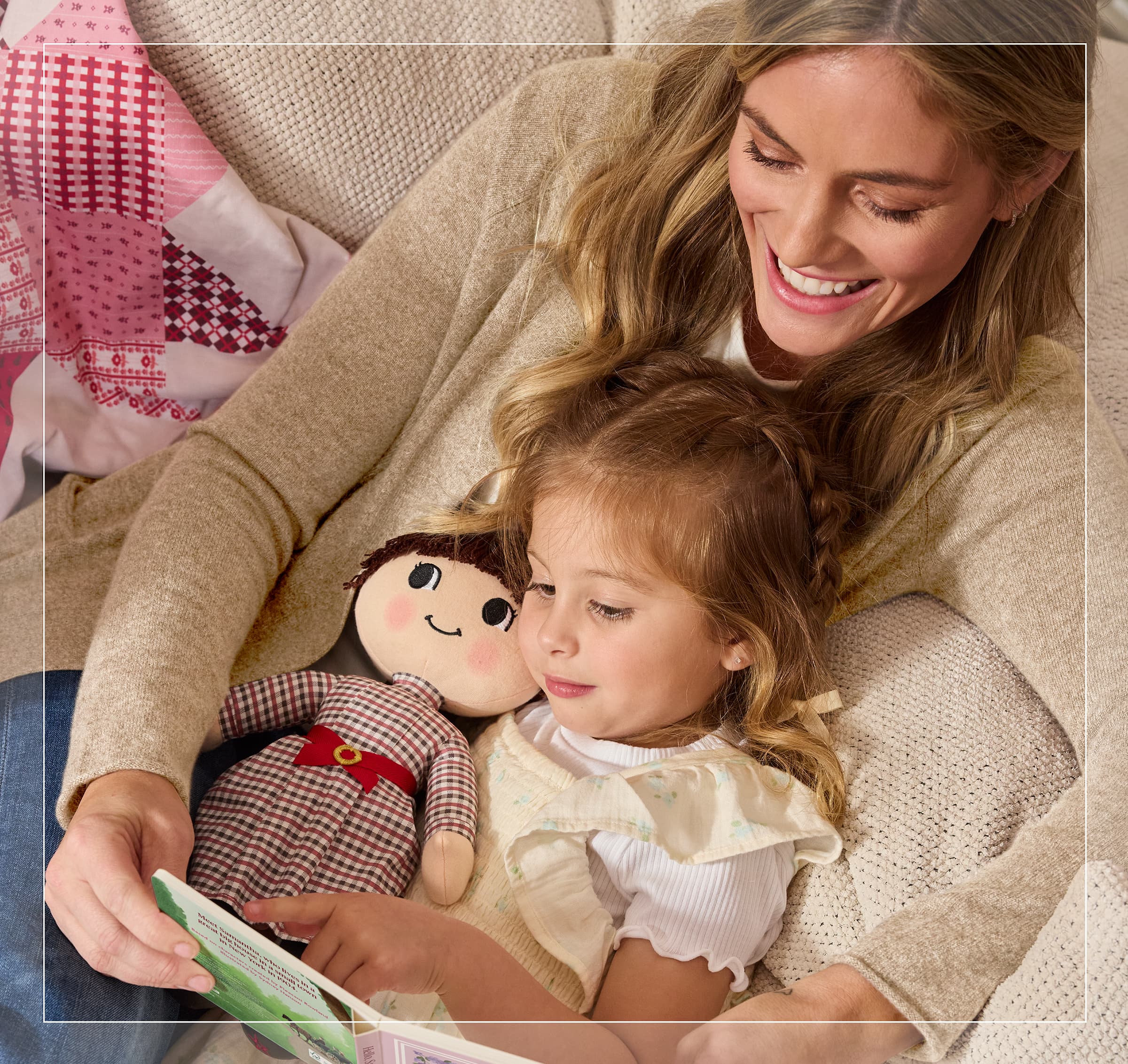 Girl holding Samantha Parkington plush doll