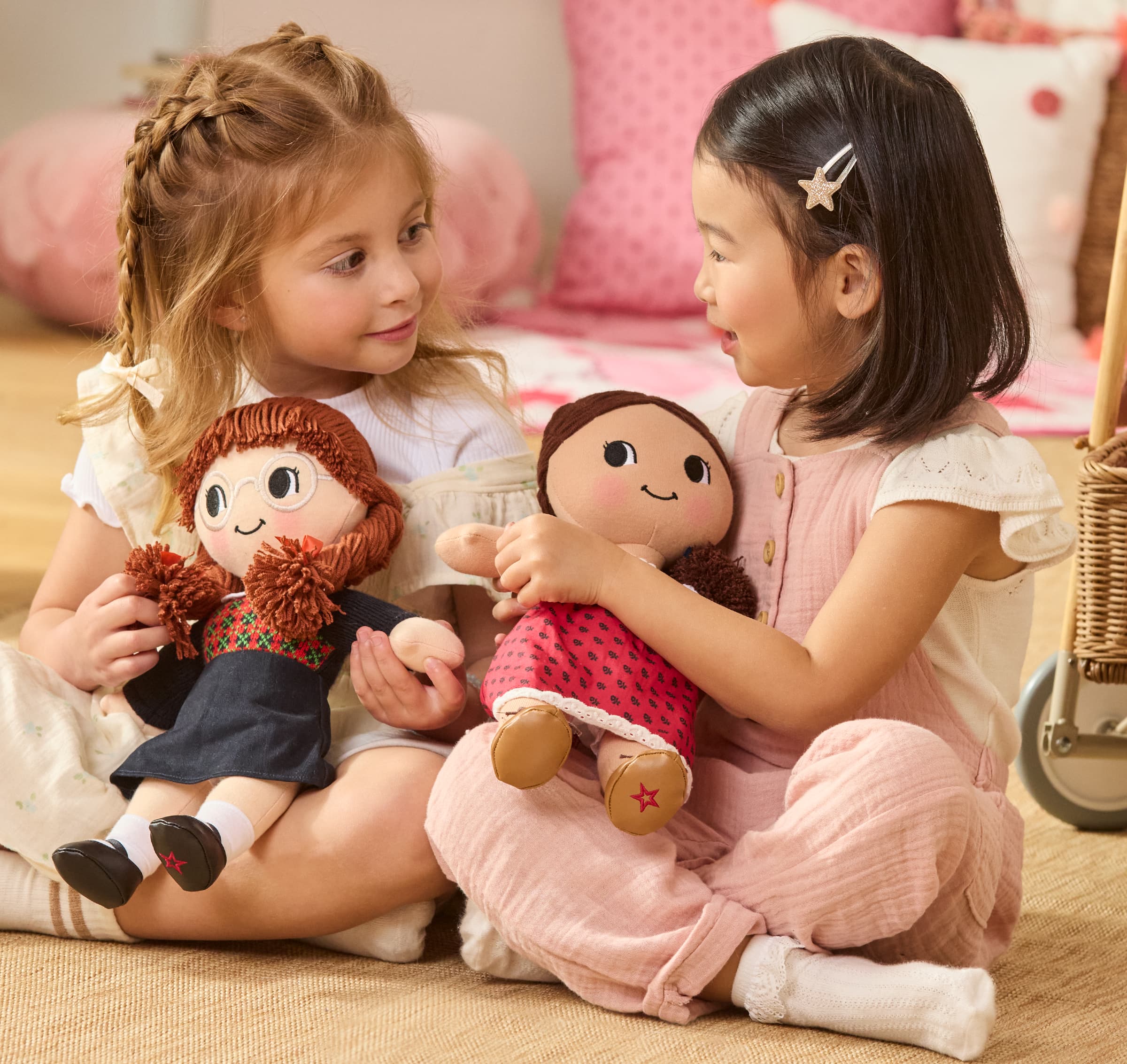 Girl holding Josefina Montoya plush doll