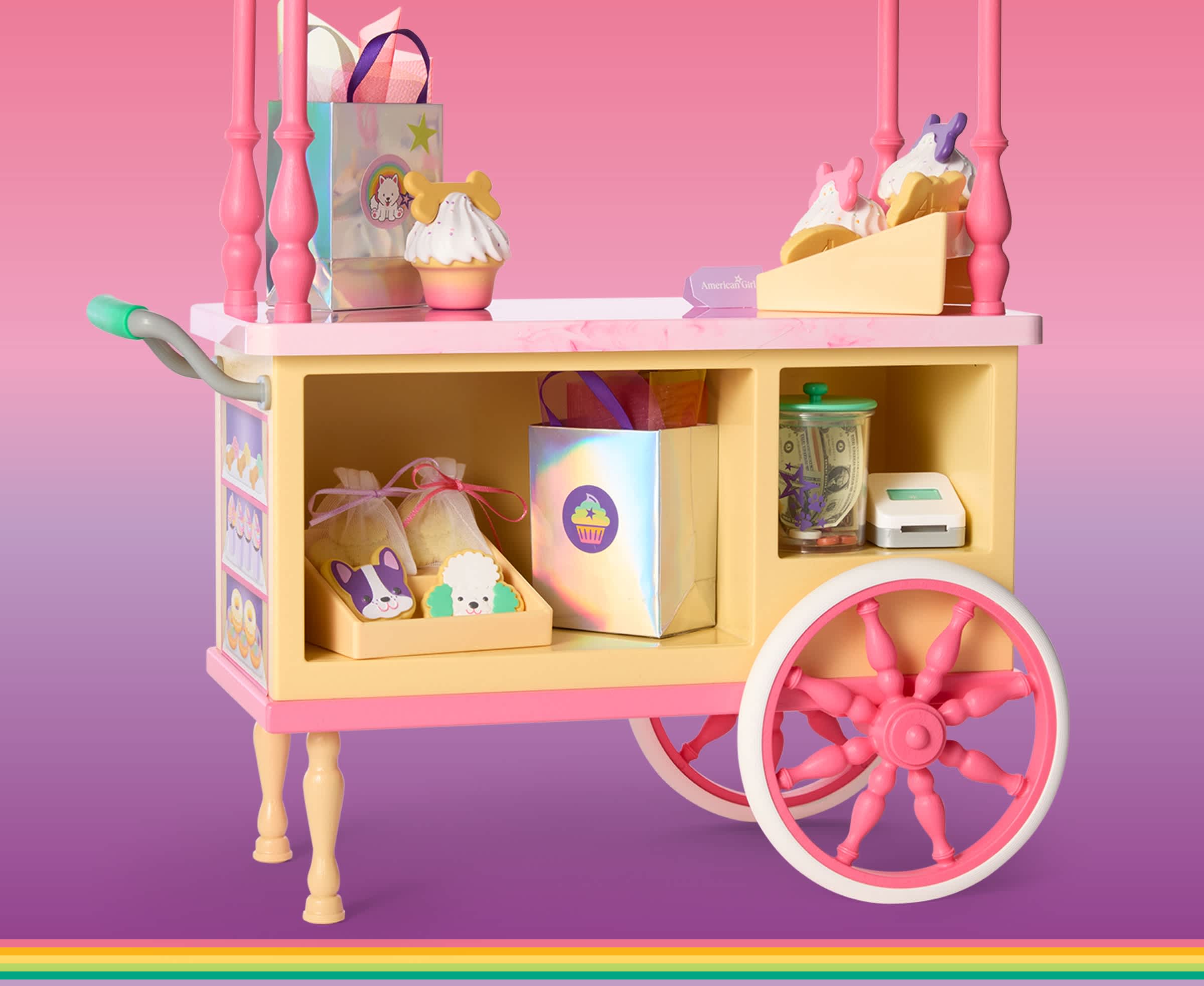 Summer McKinny's treat cart against a pink and purple background