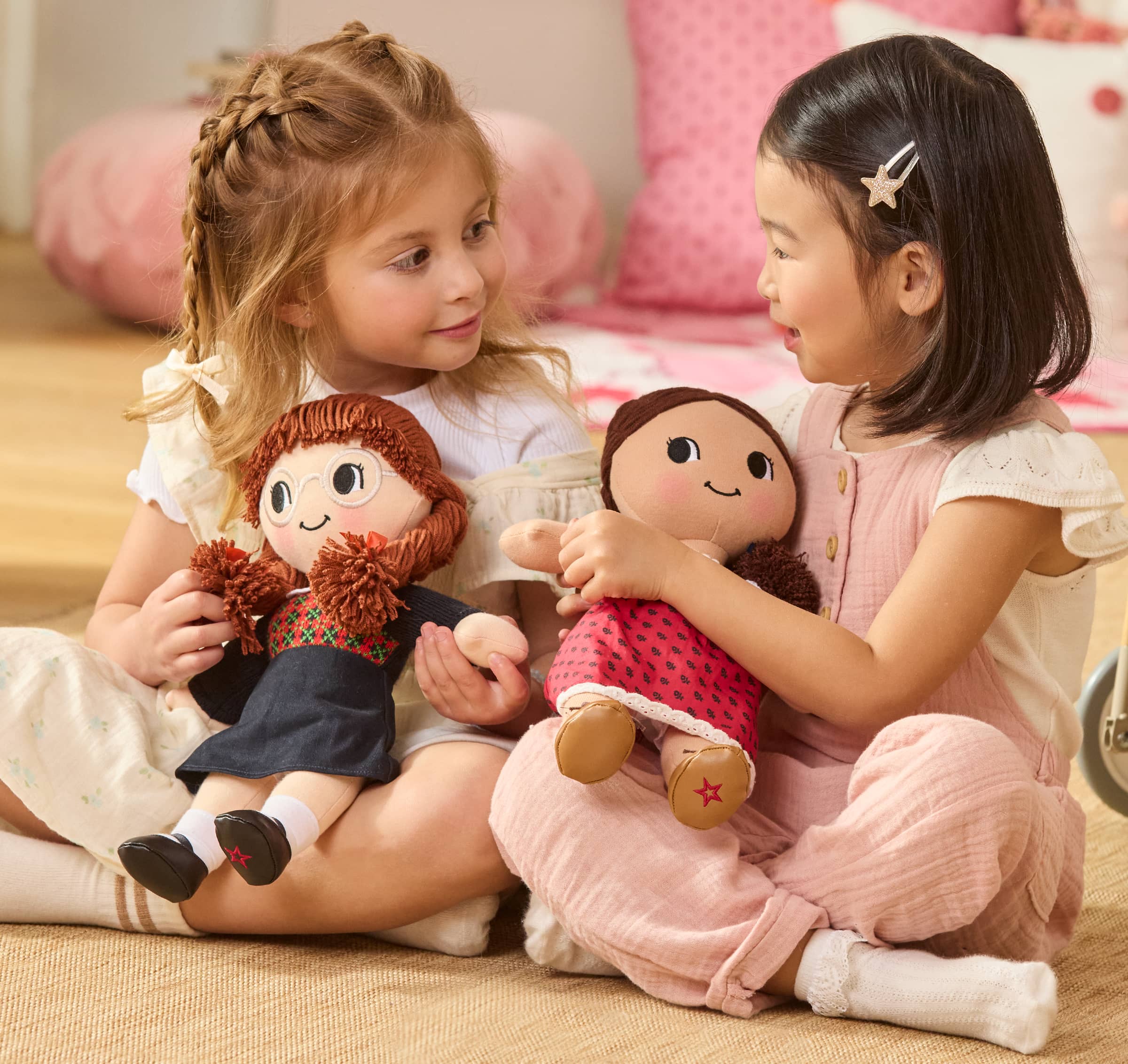 Girl holding Molly McIntire plush doll