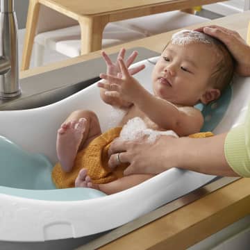 Fisher price whale hotsell tub baby stopper