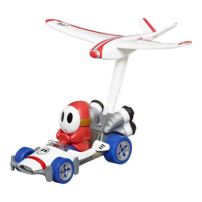 Hot Wheels Mario Kart Vehículo de Juguete Shy Guy B Dasher con Plane Glider
