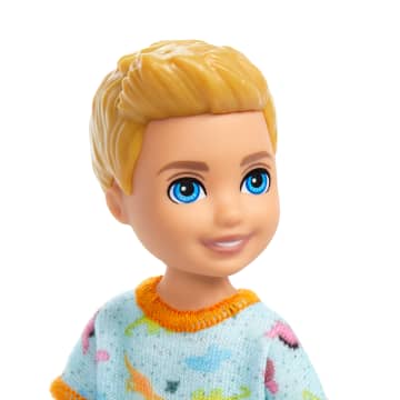 Barbie Chelsea Doll, Small Boy Doll Wearing Removable One-Piece With Dino Print, Blond Hair & Blue Eyes - Imagen 2 de 6